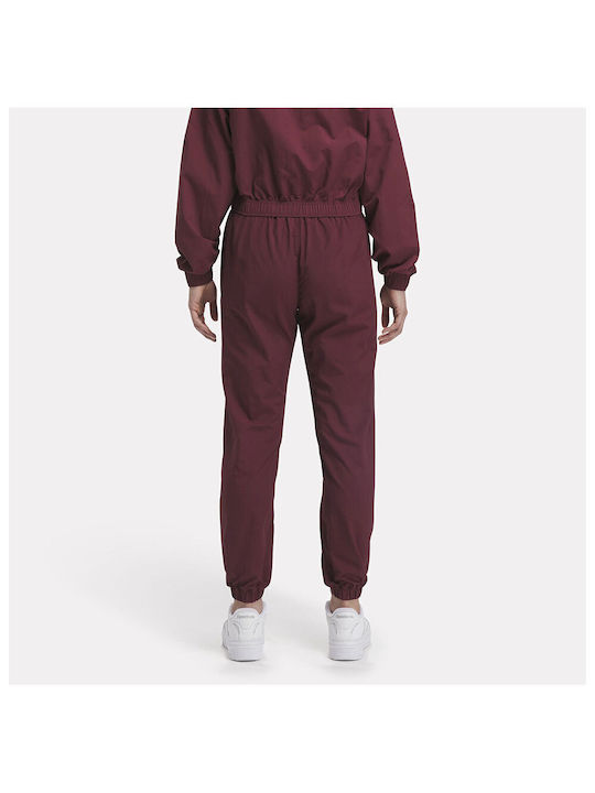 Reebok Pantaloni de trening pentru femei CLASSIC MAROON IL4627