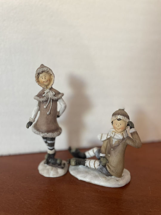 Set of Christmas Figures 1 Standing Girl 1 Sitting Boy Ice Skates