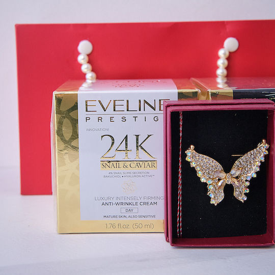 Tenderness Gift Set Butterfly Martisor Brooch Eveline Prestige Snail Caviar Anti-aging Day Cream 50 Ml Eveline Prestige Snail Caviar Face Serum In Elegant Handbag-style Pouch Red Gold