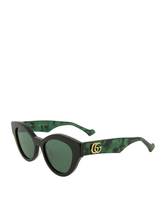 Gucci Woman Sunglasses With Black Horn-Rimmed Frame And Grey Lens GG0957S 001