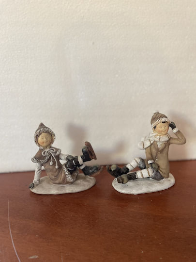 Set of Christmas Figures 1 Girl 1 Boy Sitting Skates