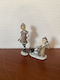 Set of Christmas Figures 1 Standing Girl 1 Sitting Boy Ice Skates