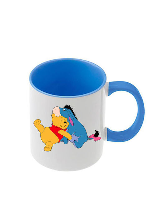 Winnie-Pooh-Tasse mit hellblauem Henkel und hel...