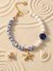 Lysea Women's Steel ID Bracelet Gold Plated with Pearls